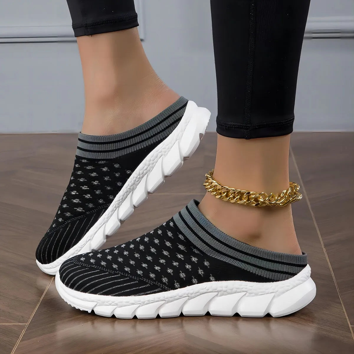 Women's black striped Flyknit slipper shoes with a height-increasing sole on a plain background