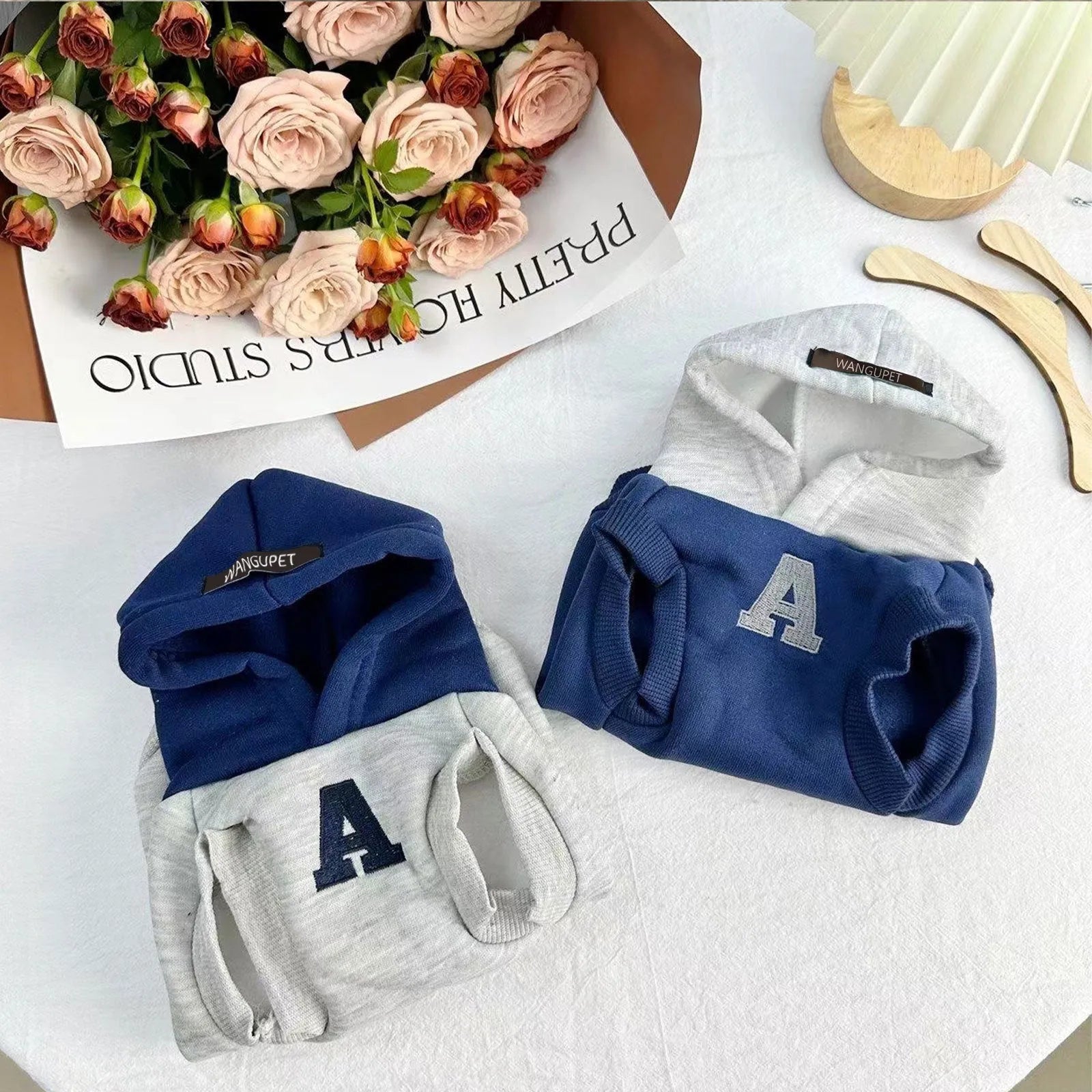 Blue and white slim-fitting pet hoodie with reflective letters for dogs and cats.