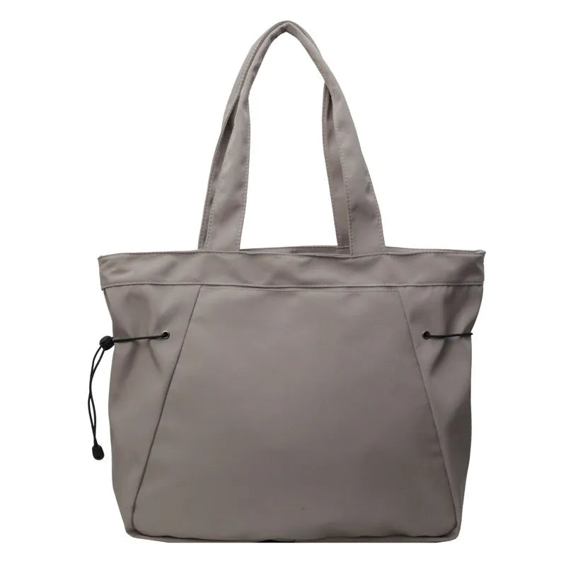 Soft foldable Oxford cloth commuter shoulder tote bag shown in light grey colour.
