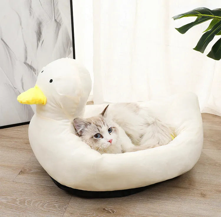 Blue duck-shaped soft polyester pet bed sofa for small dogs and cats on a wooden floor.