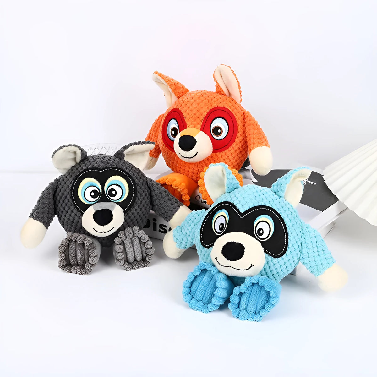 Bite resistant dog plush toy for tooth cleaning measuring 27x24cm in blue, gray, orange