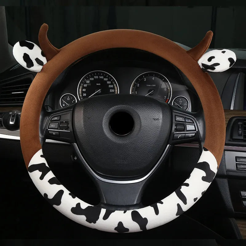 Short plush car steering wheel cover in black colour showing 38cm diameter measurement