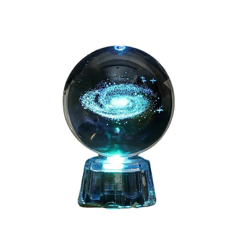 Transparent 6cm white crystal ball ornament with inner carving on a tabletop.