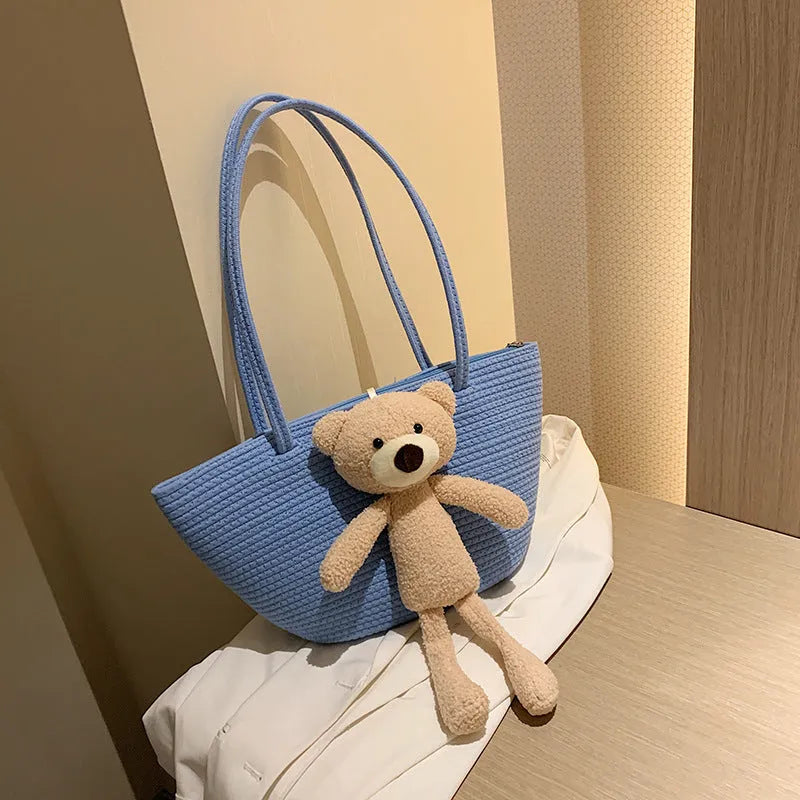 Cotton and linen woven dumpling-shaped shoulder bag with double straps in khaki colour.