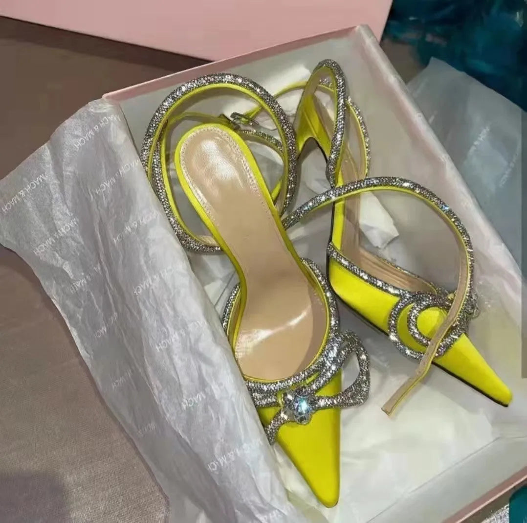 Women's black stiletto heel sandals with a silk back bandage and buckle closure.