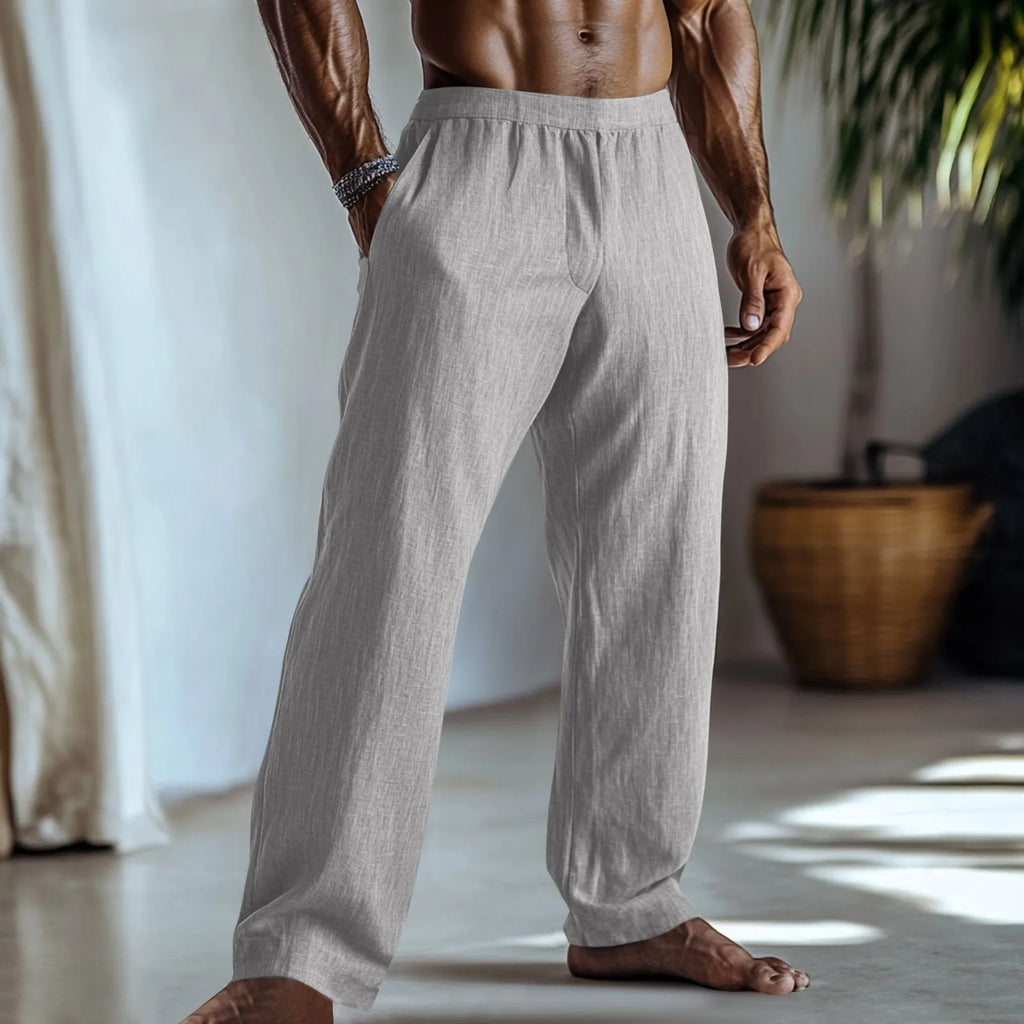 Man wearing straight-leg cotton linen casual trousers in a solid colour with pockets.