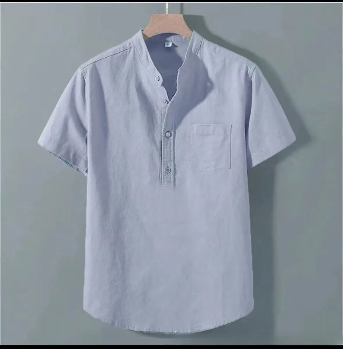Men's beige loose-fit linen casual shirt with a stand collar and short sleeves on a hanger.