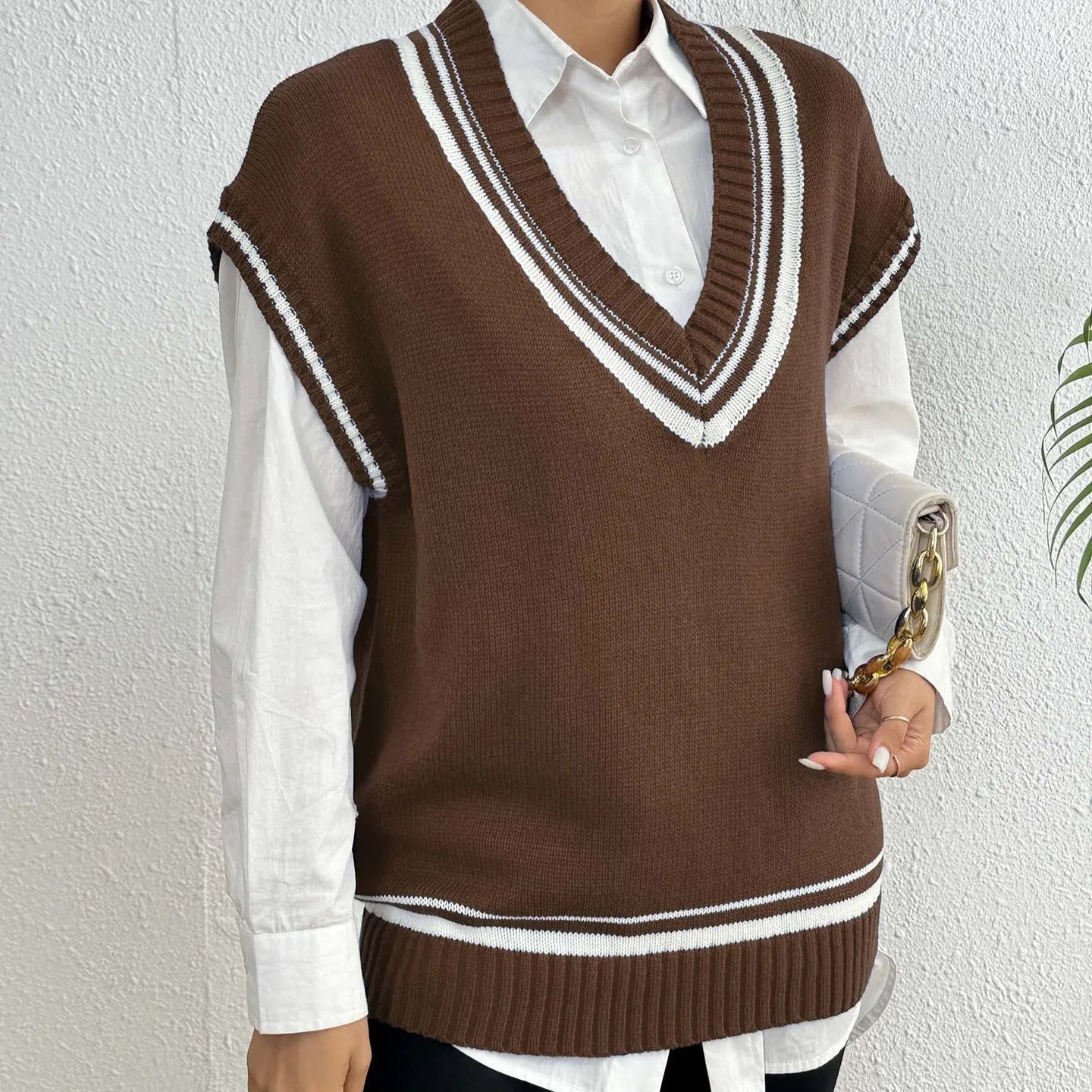 Women's college style acrylic blend sweater vest in loose pullover design