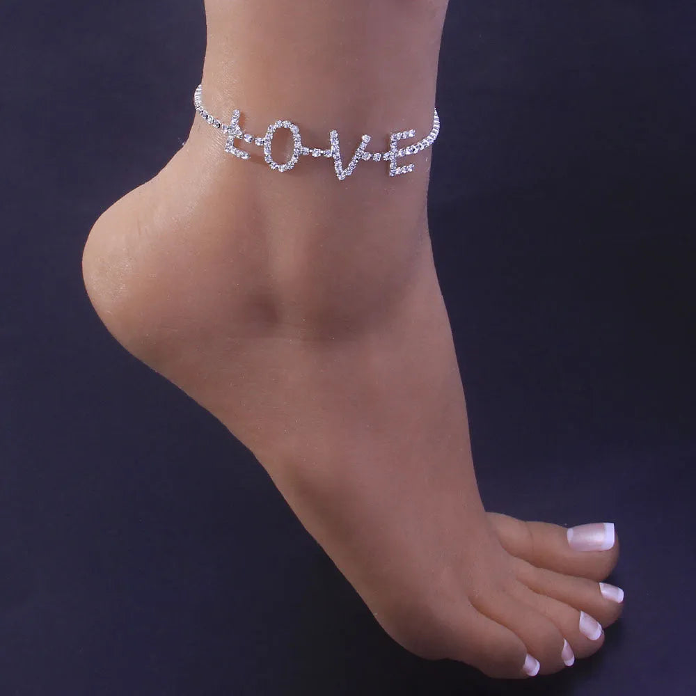 Gold letter anklet spelling LOVE with clear rhinestones on copper chain