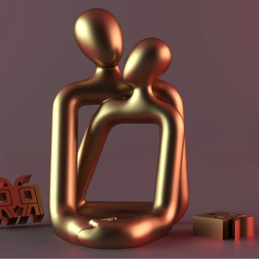 Modern minimalist resin statue of a loving couple in gold or milky white finish.