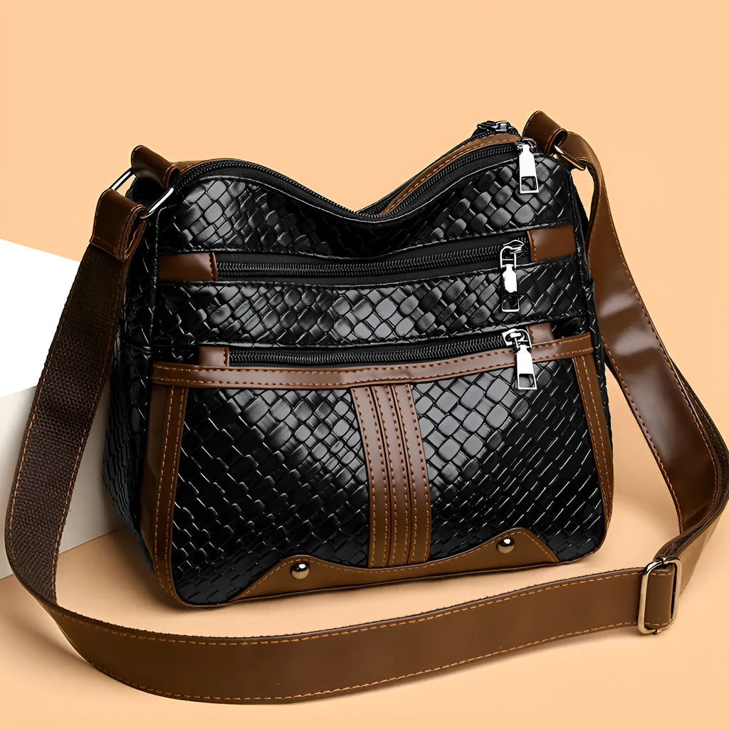 Woven PU messenger bag with multiple compartments showing zipper change bag section in brown colour