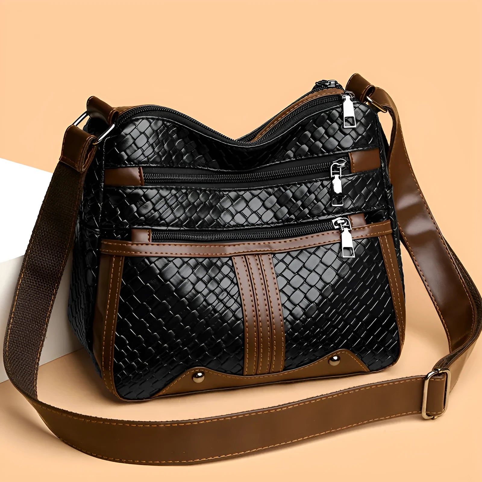 Woven PU messenger bag with multiple compartments showing zipper change bag section in brown colour