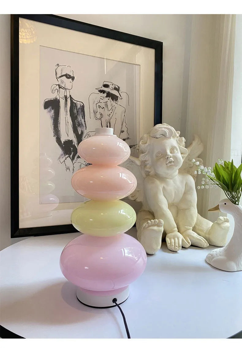 Candy String Rainbow Floor Lamp in creative macaron style with glass shade and iron body on a wooden table