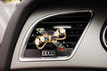 Alloy car perfume clip with liquid fruity scent attached to air vent in various cartoon styles