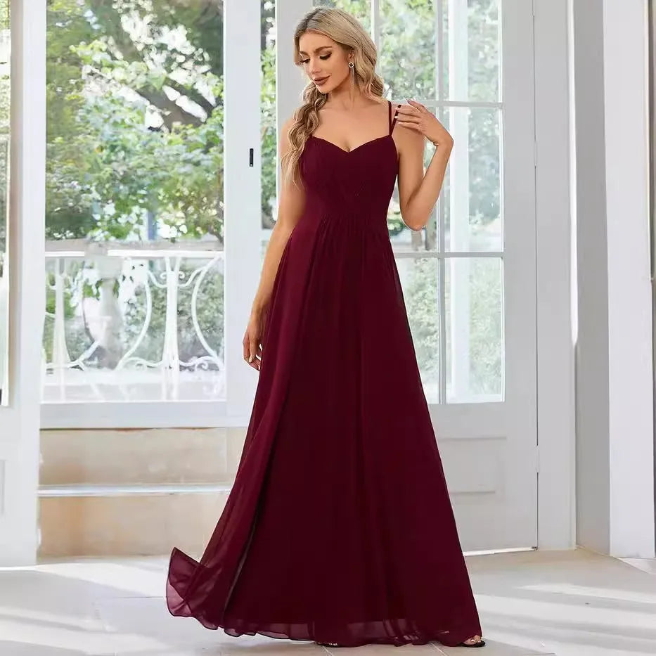 Women's long pleated A-line dress with sleeveless sling neckline in solid colours