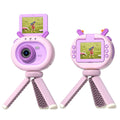 Purple and dark green children's digital camera with flip screen showing front and back views with accessories