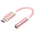 Close-up of a short black nylon braided Type-C to 3.5mm female headphone adapter cable.