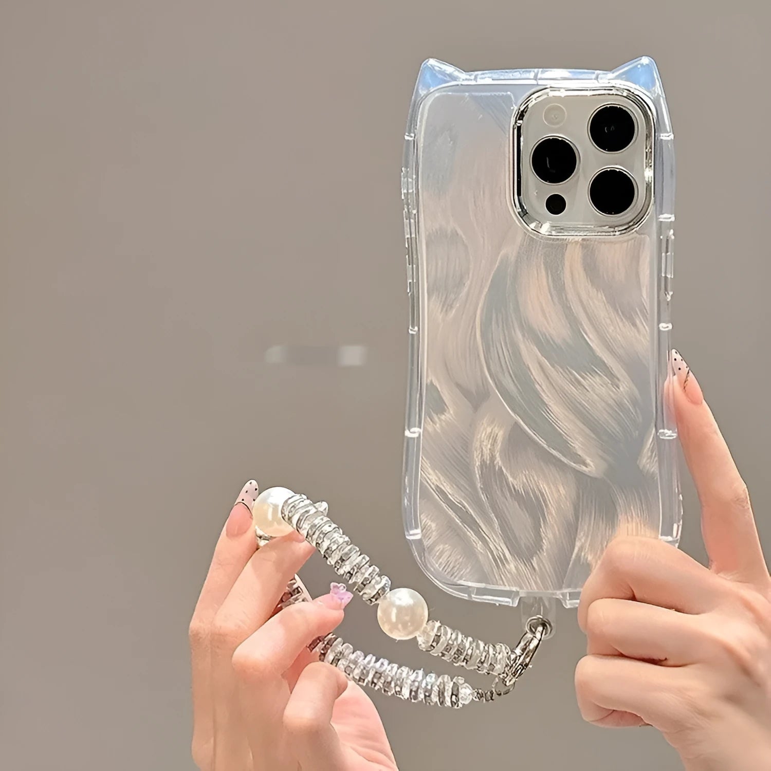 Cat ear feather yarn silicone phone case with shell chain for iPhone, showing front and back views