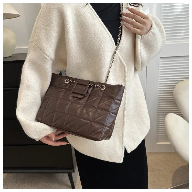 Women's soft PU shoulder bag with chain strap in trapezoid shape, black colour option