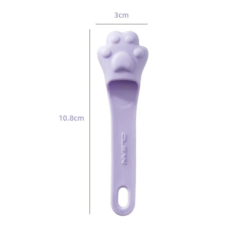 Silicone finger cover toothbrush for pet dental cleaning in pink, purple, and yellow colours.