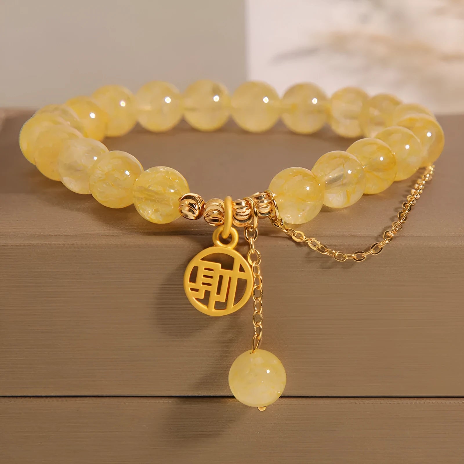 Natural stone citrine bracelet with Chinese character tassel in either Cai or Fu design