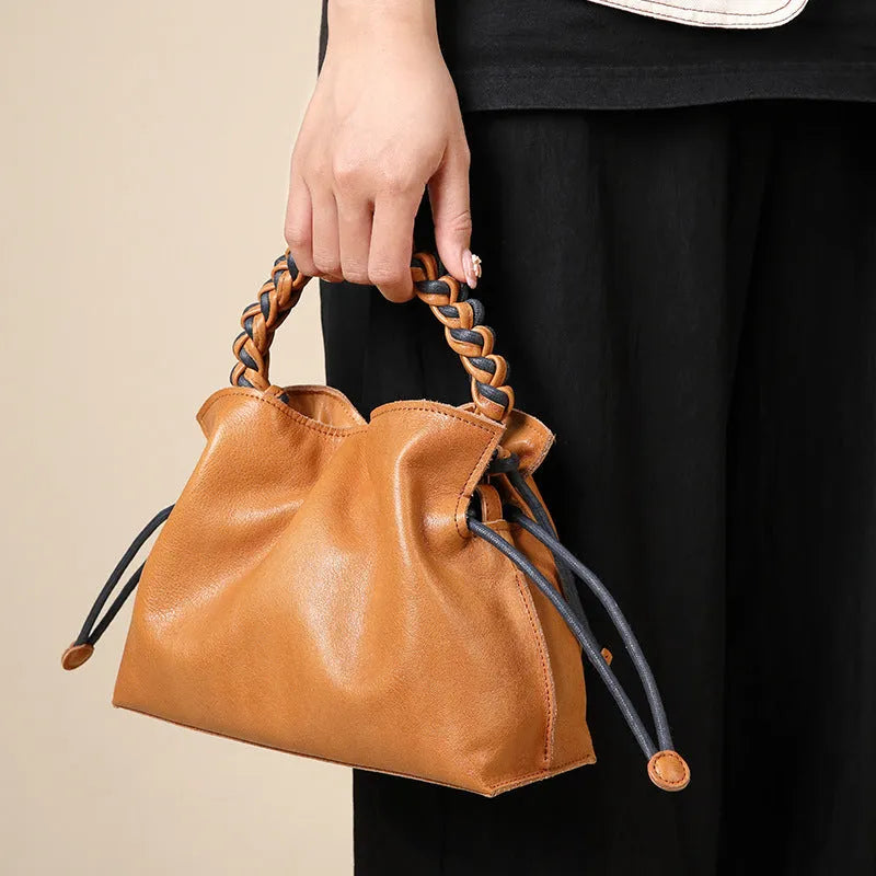 Women's cortex splicing woven leather crossbody bag in orange colour with top grain leather finish and zipper closure