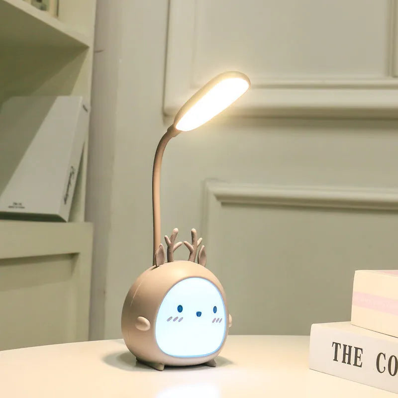 Cartoon deer USB charging folding LED reading lamp with plastic shade on desk