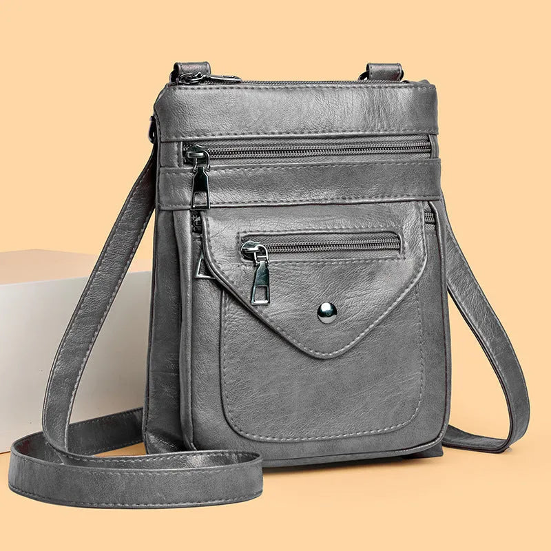 Vertical crossbody mobile phone bag in square shape with sewing line details