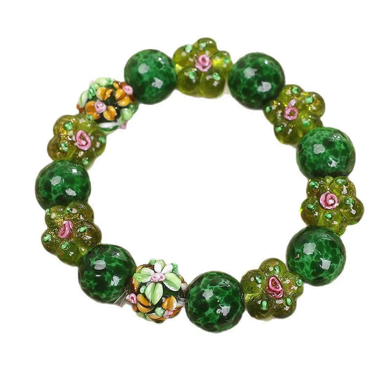 Chinese ancient flower glazed bracelet for women, green electroplated finish with floral charm