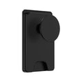Minimalist black magnetic suction phone holder for iPhone on an office desk.