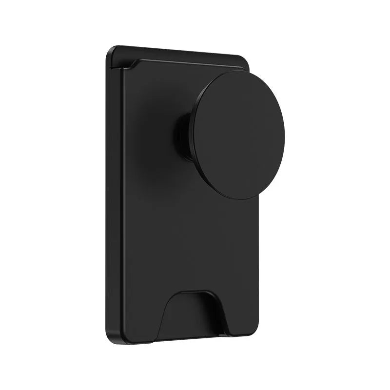 Minimalist black magnetic suction phone holder for iPhone on an office desk.