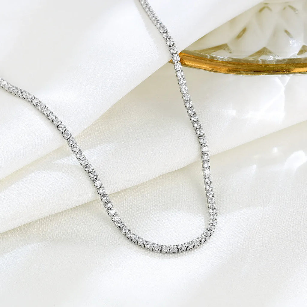 Women's sterling silver necklace with diamond-cut round pendant on fine chain
