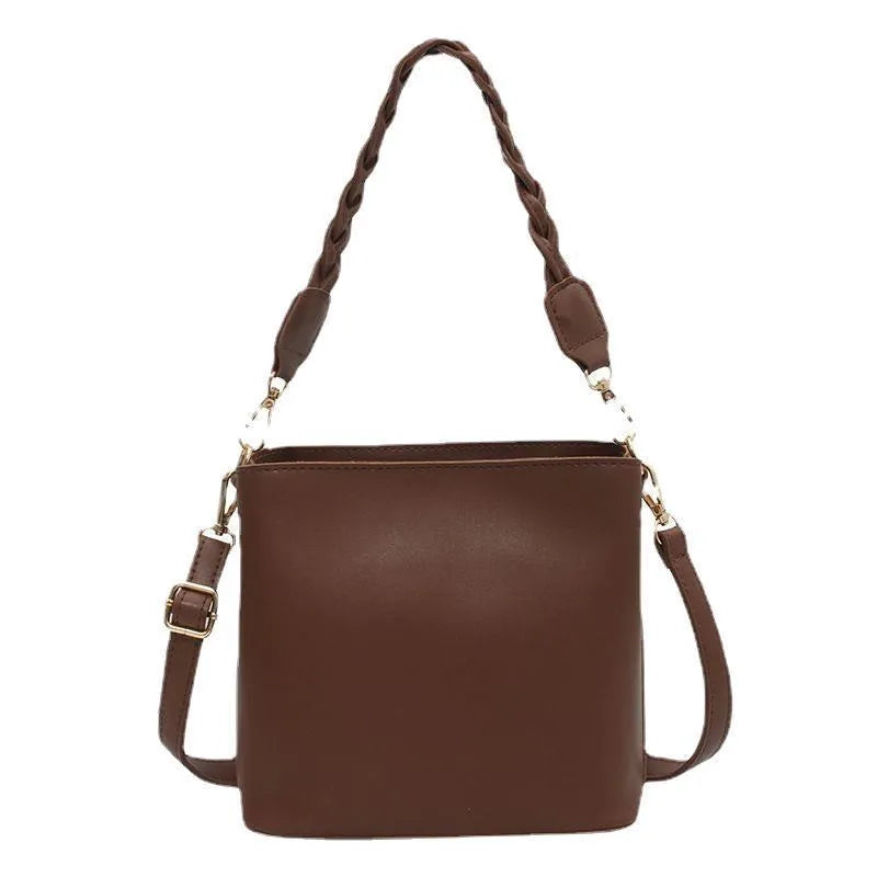 Retro brown PU bucket bag with weaving detail, shown as a one-shoulder crossbody underarm bag.