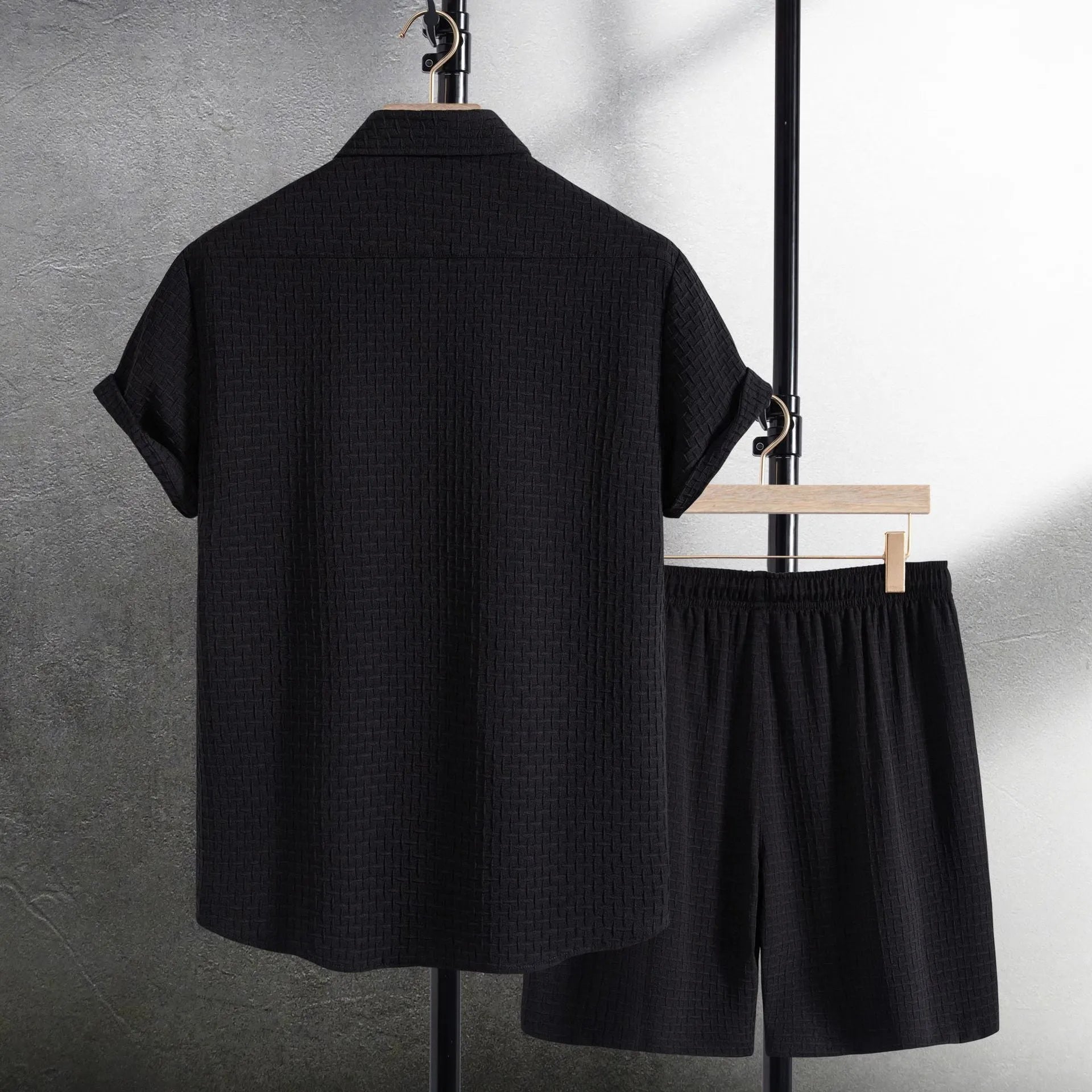 Men's white cotton blend beach shirt and shorts suit set laid flat showing cardigan style and short sleeves