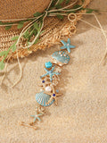 Alloy rhinestone bracelet with boat anchor and starfish charm in turquoise, red, or blue.