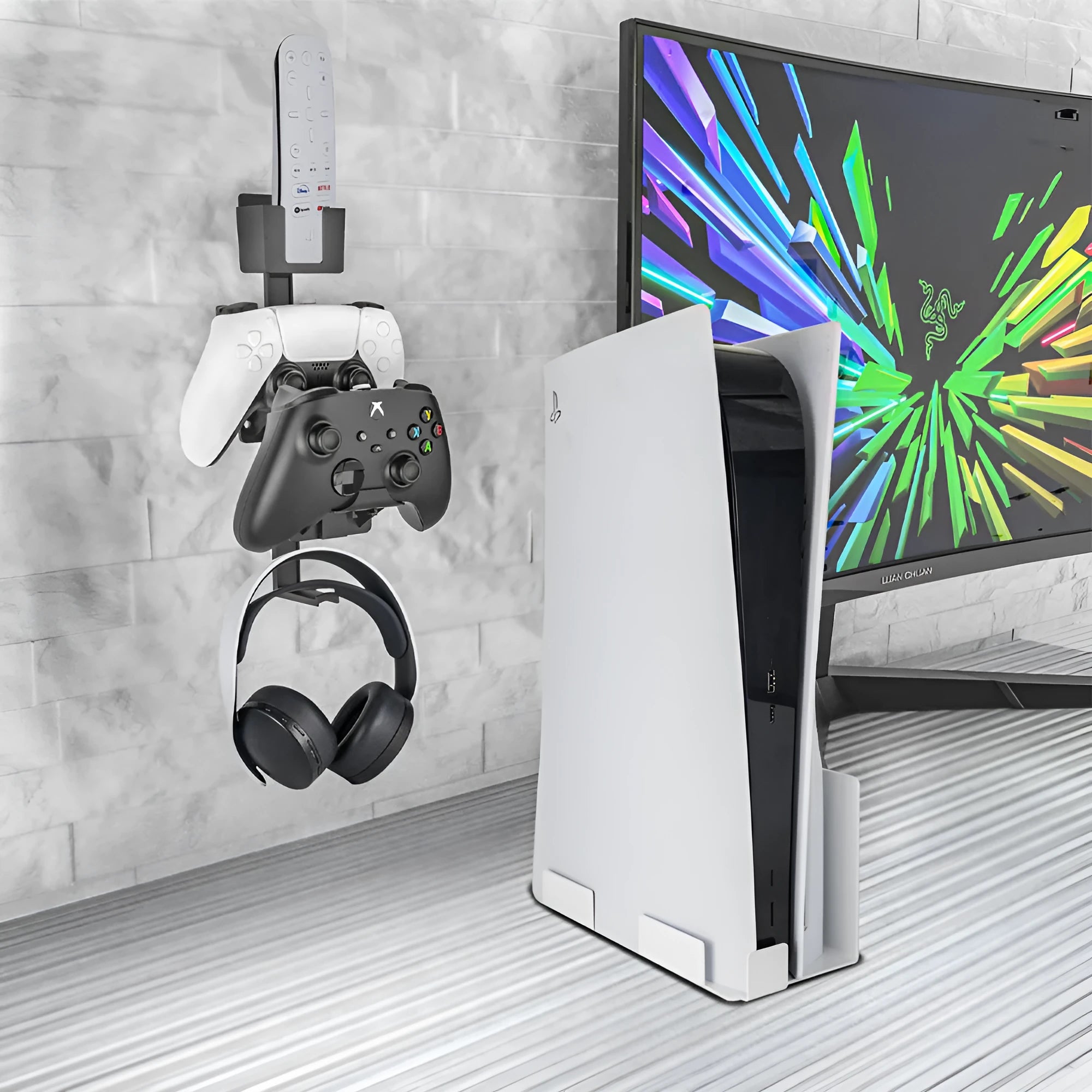 White wall-mounted plastic hook holding a game controller and a gaming headset.