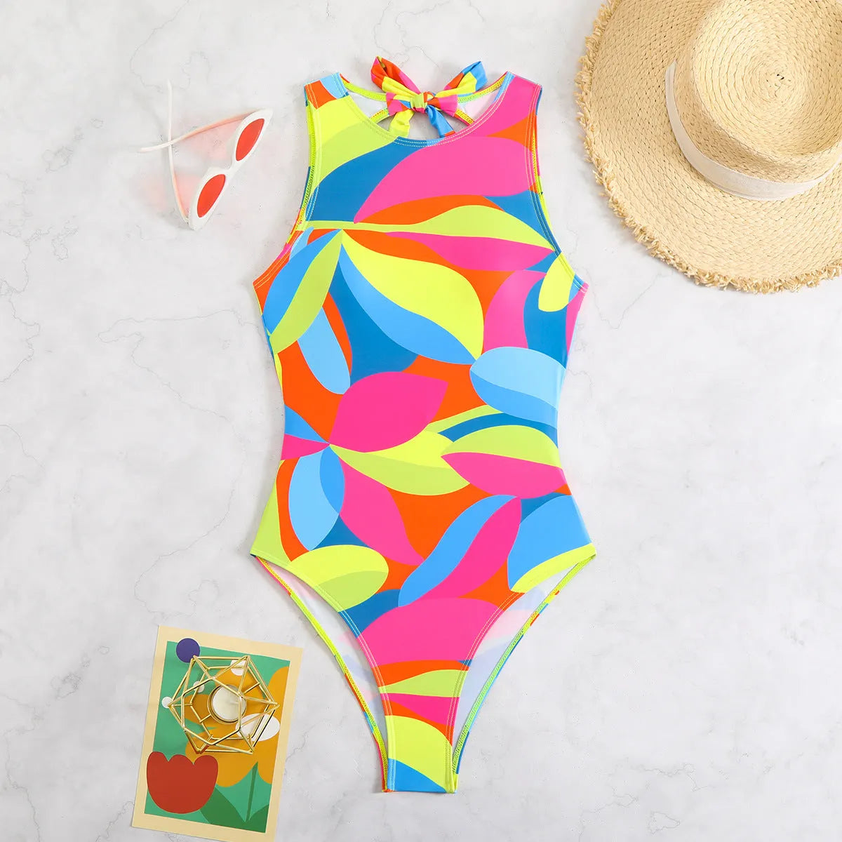 Women's multi-colour printed one-piece swimsuit, tight fit, available in sizes S M L XL, black colour option