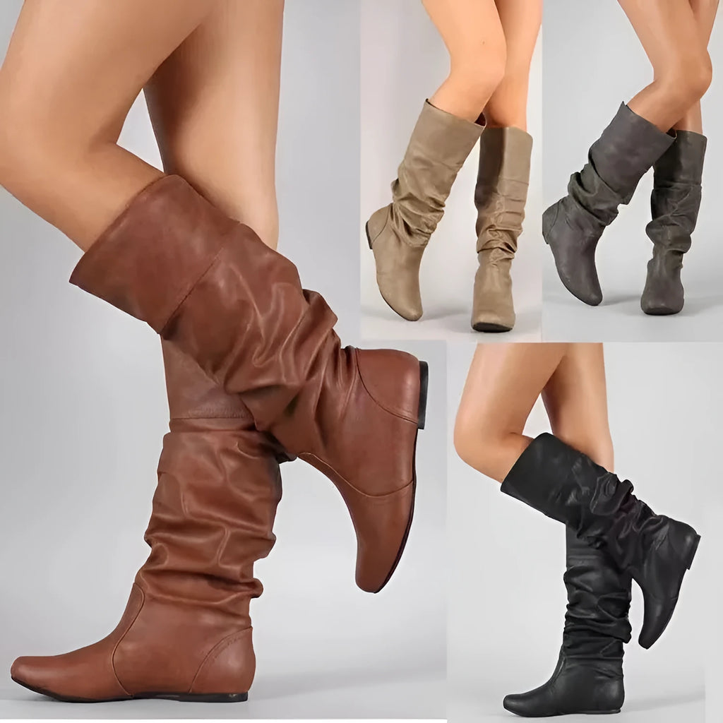 Women's flat round toe slip-on ankle boots in black PU leather with a high shaft and rubber sole.