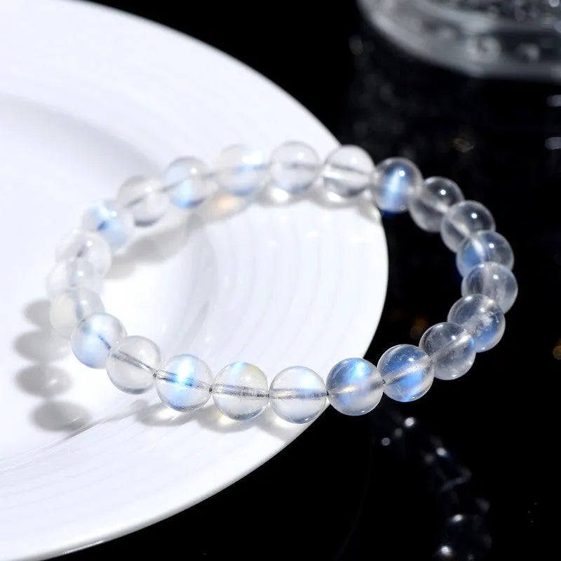 Natural cream body blue moonlight crystal bracelet showing various bead size options on a white background.
