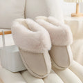 Women's brown plush winter slippers with artificial wool lining and anti-slip PVC sole shown from side view