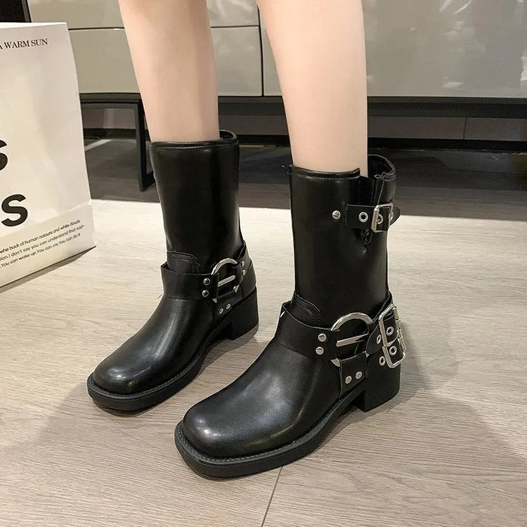 Women's black platform boots with buckle strap at middle calf length