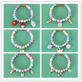 Colourful resin necklace collar and bracelet set for a dog, showing macaron-themed rabbit and moon charms.