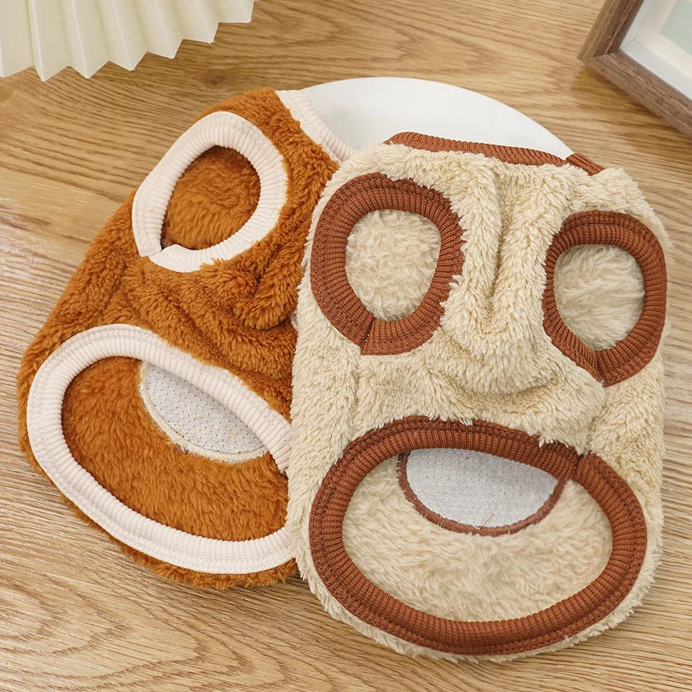 Fleece-lined warm dog clothes in cream with brown bear ears on a small dog