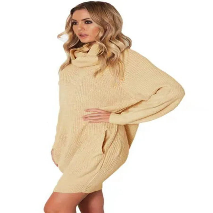 Light apricot coloured mid-length pullover sweater with a lapel collar and side pockets on a model.