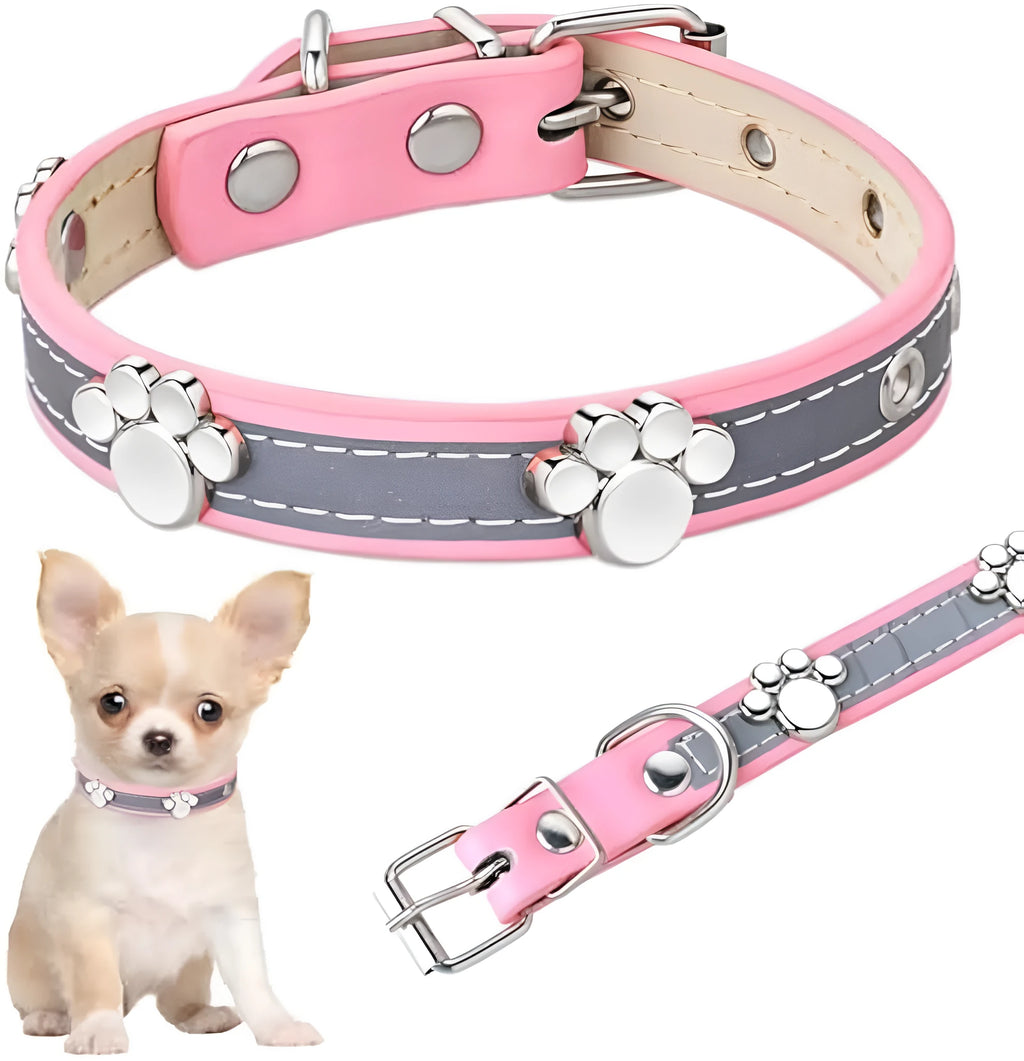 Reflective adjustable leather dog collar with cute paw rivet on a grey background.