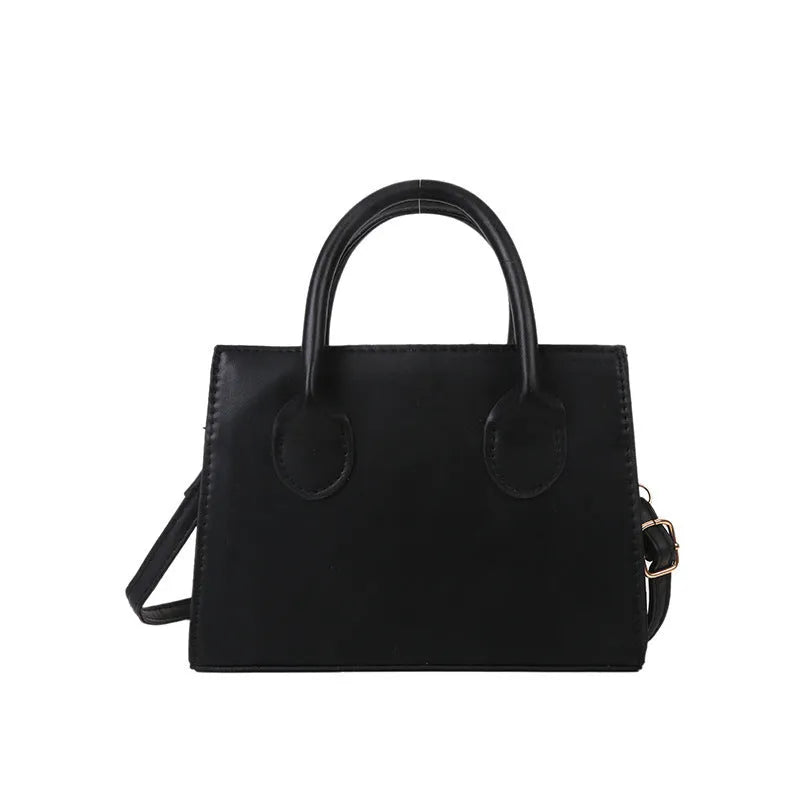 PU synthetic leather small horizontal square shoulder bag in five colour options showing document pocket and single strap