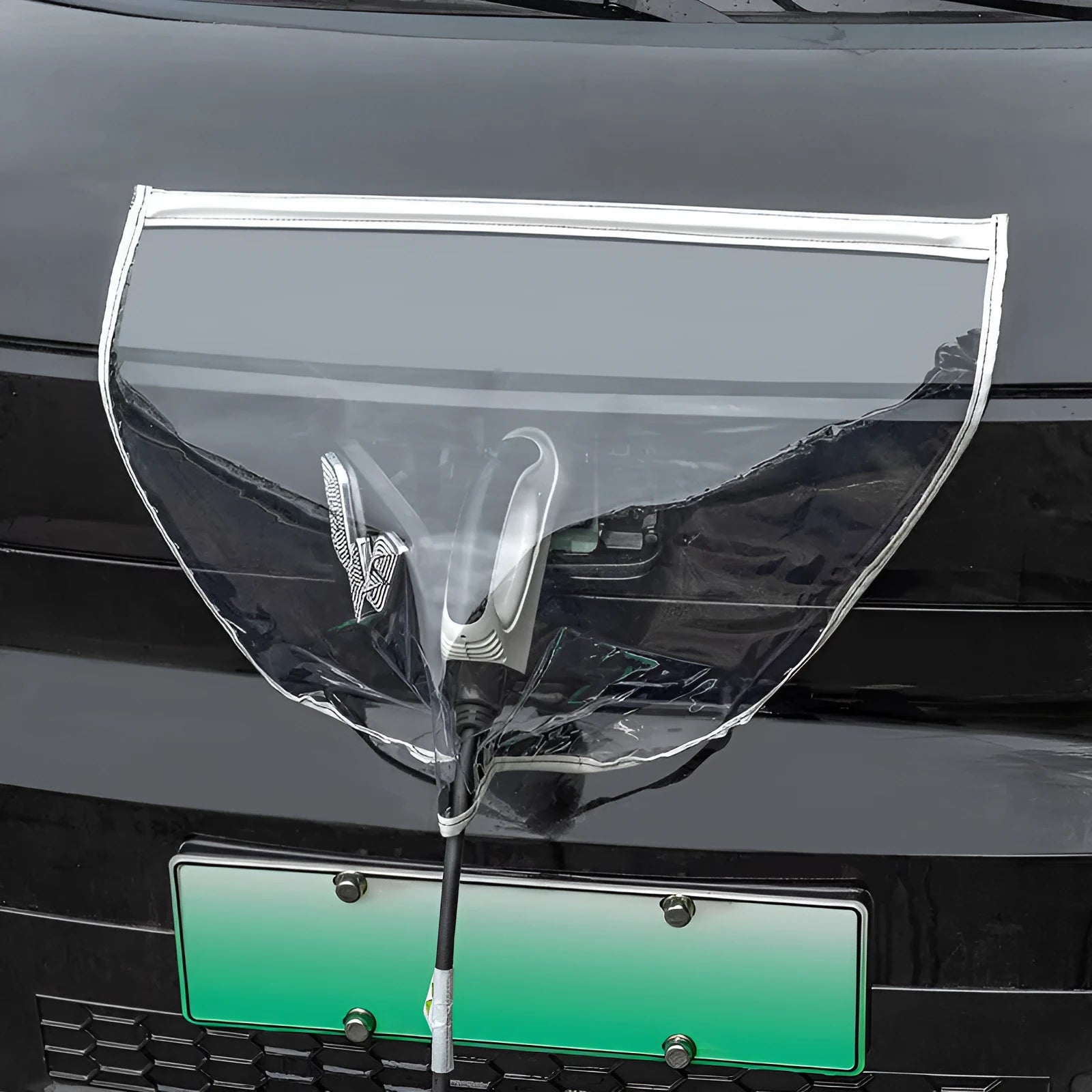 Black waterproof PVC rain cover for electric vehicle charging gun with magnetic strips.