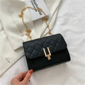 Women's black PU leather crossbody bag with diamond lattice chain detail and adjustable shoulder strap