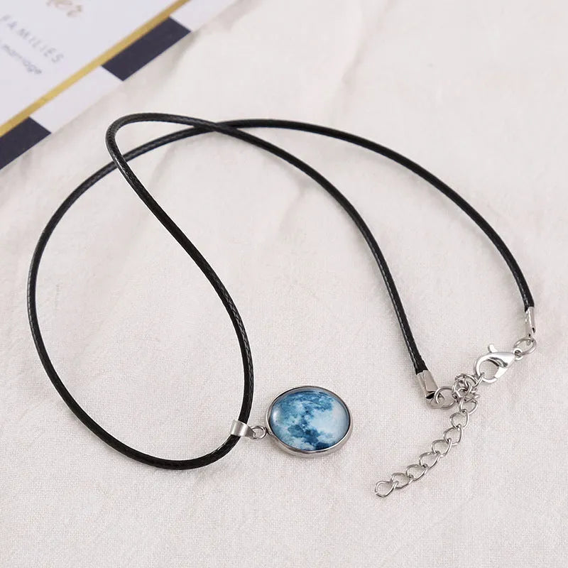 Luminous alloy pendant necklace with constellation design in coloured glass, showing extension chain