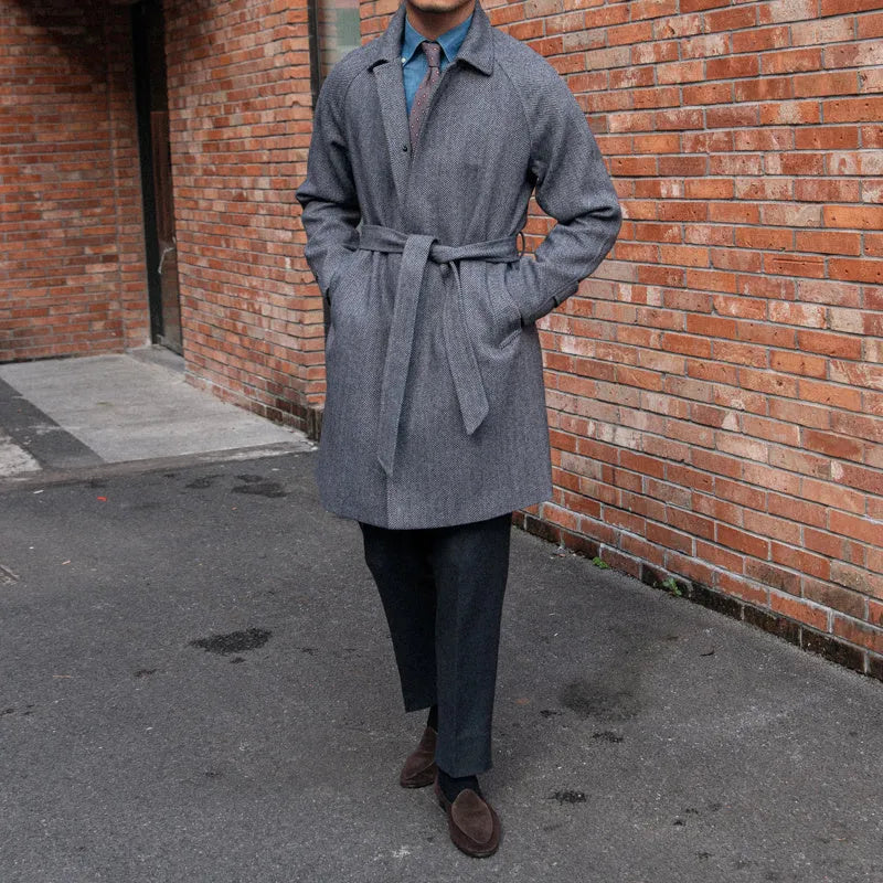 Men's herringbone wool slim fit mid length coat in blue with lapel collar and single-breasted placket